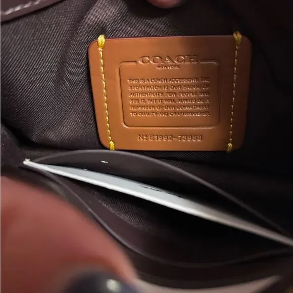 Coach Signature Dreamer Brown and White Women's Wristlet with Cherry Charm - Picture 8 of 9